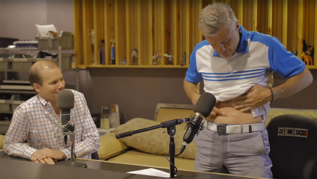 Vic Lombardi points out his scars during a podcast with UCHealth and CU School of Medicine urologic oncologist Dr. Paul Maroni, whose robotic surgery led to those scars.