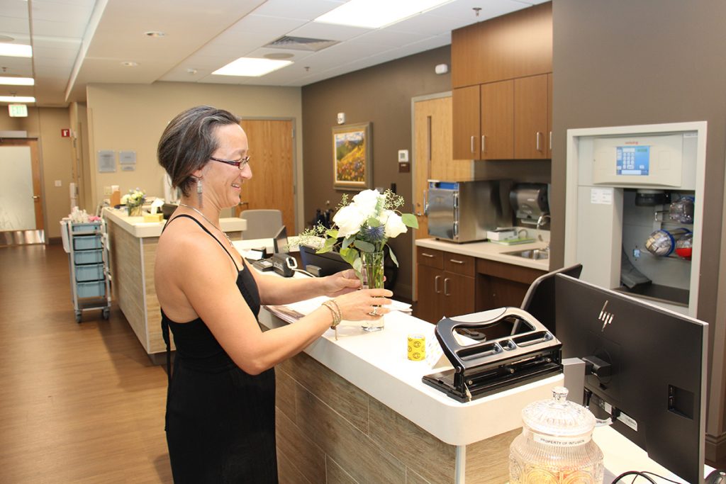 Alex Mathisen delivers flowers to UCHealth Jan Bishop Cancer Center.