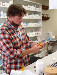 George Gess fills a patient prescription in the outpatient pharmacy at UCHealth Yampa Valley Medical Center.