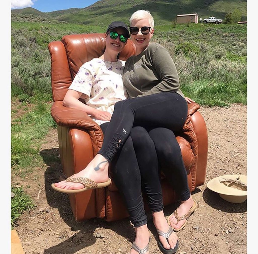 Lauren and friend, Cherie Pryor,sit in an old brown recliner that they brought to their campsite near Steamboat as a joke.