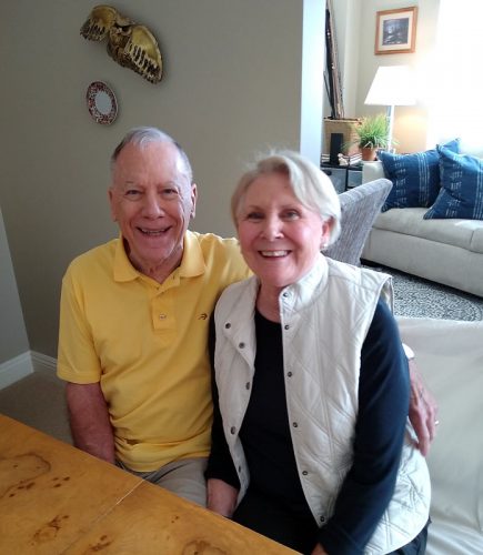 A couple smiles together, the husband who is living with dementia.
