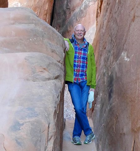 Paul Hutton after surgery for a bad spine infection, standing among the rocks at Arches National Park.