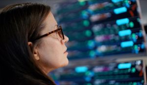 lady monitors screens at UCHealth Virtual Health Center