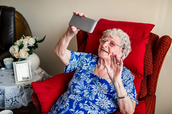 Older woman does a video call for story about helping older adults use video calling