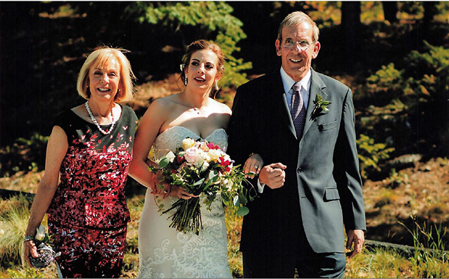 Dr. Michael Leonard, the first convalescent plasma patient leaves ICU, is pictured here with his wife, Meg, at their daughter, Molly's wedding.