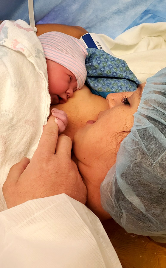 Birth in a pandemic. Deacon snuggles with mom, Amanda.