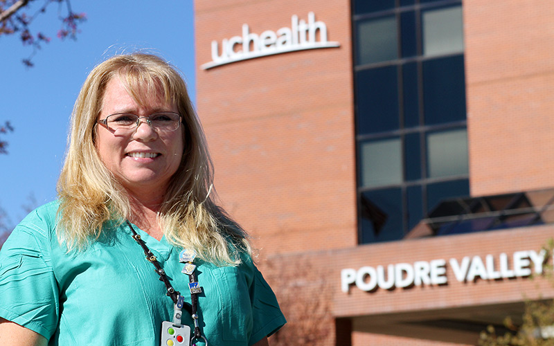 Julie in front of the hospital she works at