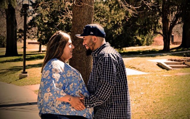 Pregnant Jade and Mike in a park. Jade would give birth while covid-positive at 35 weeks pregnant.