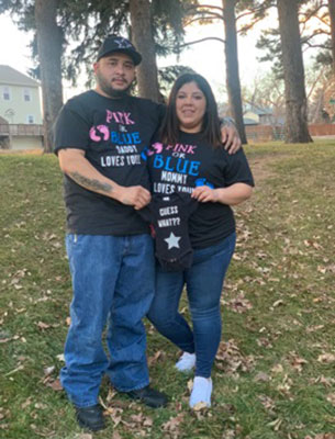 jade and Mikey with gender reveal shirts on at the park before Jade gave birth while COVID-positive a few months later.