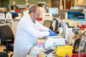 High-quality antibody tests are now available to the public in Colorado at various locations throughout Colorado. Here, a lab manager works on tests at a UCHealth lab.