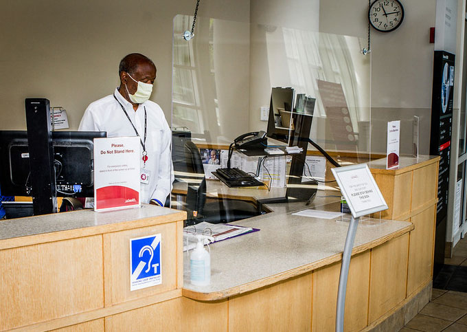 Plexiglas is just one hospital safety measure during the COVID-19 pandemic as seen at this front check in desk.