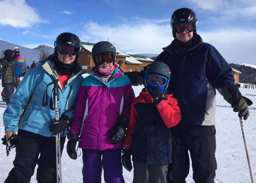 Kim Tyler with daughter Ainsley, son Andon, and husband Alejandro on the slopes. Kim hurt herself on the slopes and then her ACL repair was delayed because of the coronavirus.