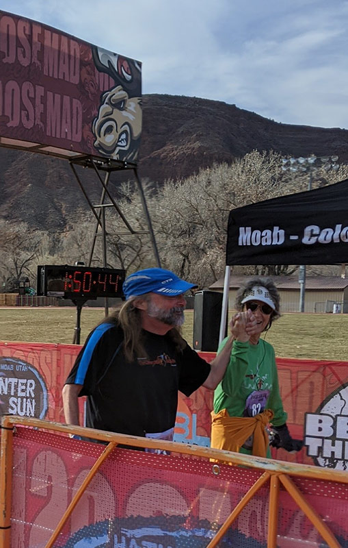 Jeff crossing the finishline of a 10K, two years after his hemorrhagic stroke treatment.