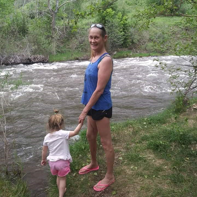 pamela, who had Ureteral reconstruction, with her granddaughter at a river.