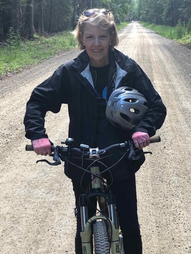 Jan Roehl-Anderson rides her bike after getting an implantable trifocal lense.
