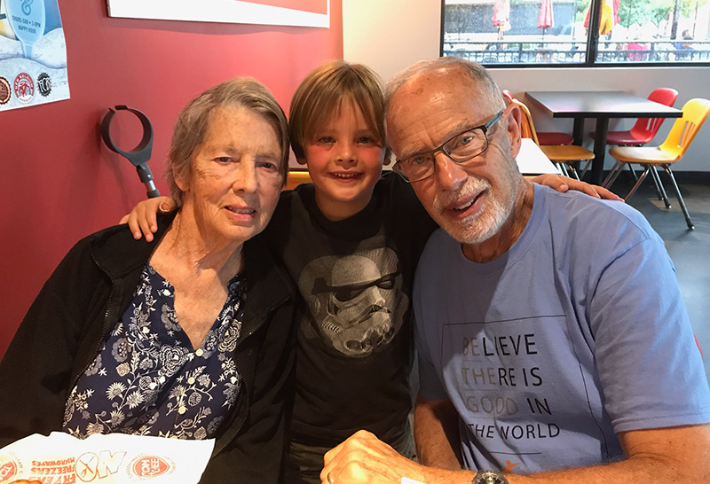 Dave, Loni and in the middle, their young grandson. his powerful tools for caregivers class made him reach out more to family for help.