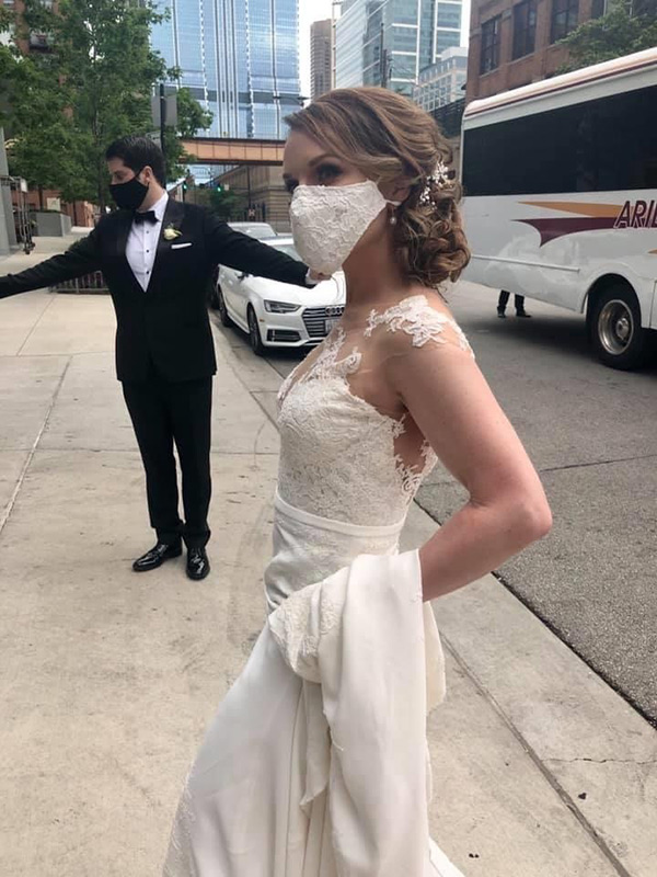 plastic surgery expert Cherry Creek. Dr. Rebekah Zaluzec in her wedding gown with a white lace mask.
