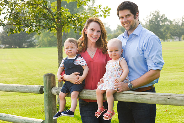Dr. Rebekah Zaluzec is a plastic surgery expert in Cherry Creek. Here she poses with her husband and their twins.