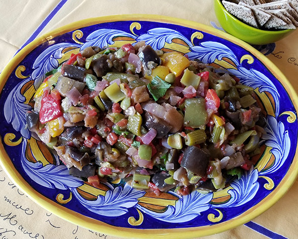 a big plate of Sicilian caponata, a vegetarian recipe with eggplants and peppers