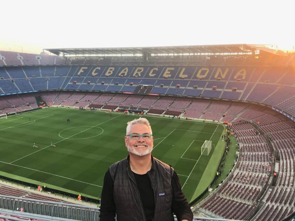 Glen Andrews in the famed soccer stadium in Barcelona, Spain. He is alive but teaches the important of recognizing the warning signs of a heart attack.