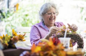 Senior women crafting and having a good time together