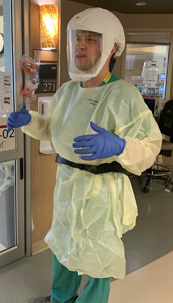 Colorado is experiencing a COVID-19 surge. Dr. Dan Pastula, a UCHealth neuroinfectious disease expert, dressed in full protective gear in a COVD-19 ICU at UCHealth University of Colorado Hospital
