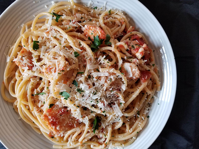 Bucatini and Wolffish Fra Diavolo on a plate