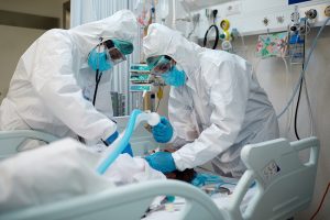 The Colorado coronavirus model shows we must act now or many people will end up in ICUs. Here, a patient with COVID-19 gets intubated in an ICU.