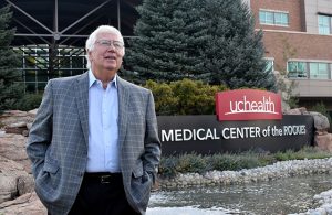 Dr. Gary Luckasen stands in front of UCHealth Medical Center of the Rockies in Loveland, Colorado where he leads a coronavirus vaccine trial.