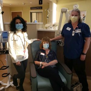Dr. Radhika Acharya, medical director of the UCHealth Cancer Center-Highlands Ranch and assistant professor of medicine at CU School of Medicine; UCHealth patient and cancer survivor Suzi McCumber; and Vicki Slat-Vasquez, a registered nurse at UCHealth Cancer Center-Highlands Ranch Infusion Center.