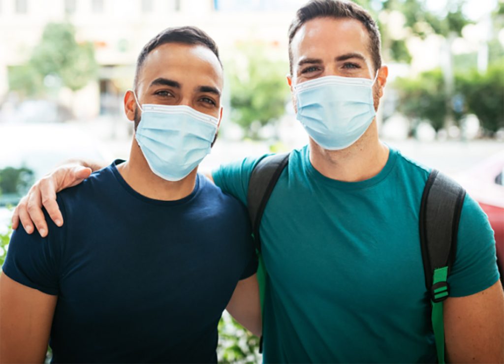 Two men wearing masks.