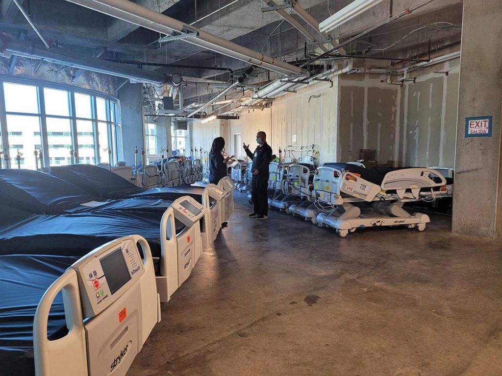 Additional beds need to accomodate a surge in COVID-19 patients are in a warehouse at Memorial Hospital Central.