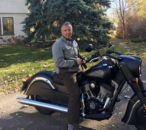 Dr. Richard Zane is confident that vaccines for COVID-19 are safe. He looks forward to a time when the pandemic is over and he has time to ride his motorcycle again.