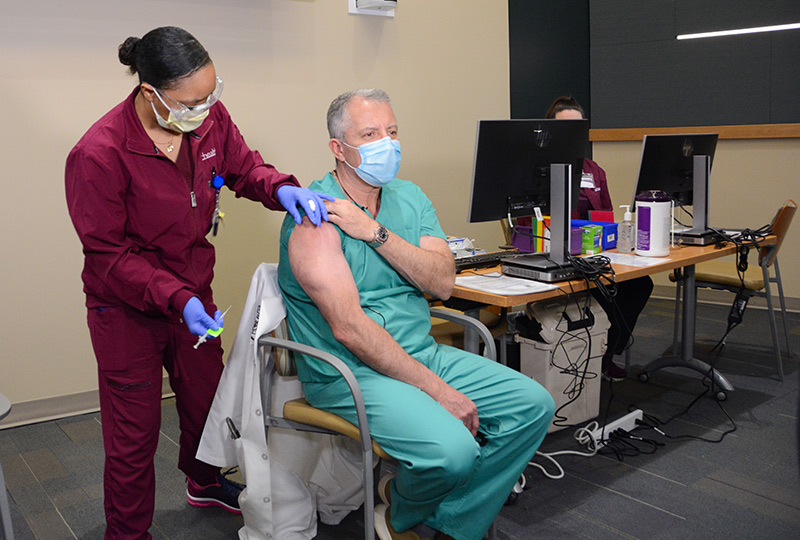 Dr. Richard Zane receives his COVID-19 vaccine.