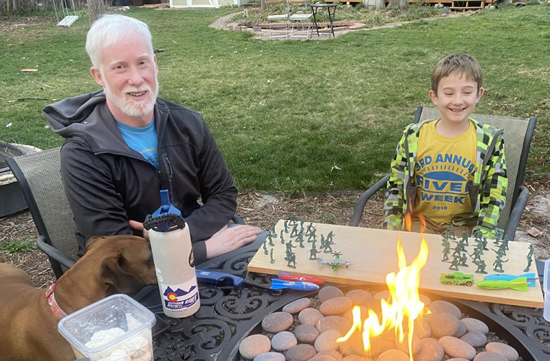 Garry Keller enjoys time with his son, Boden, in their backyard. Boden thinks his dad is a "superhero" not only because he fought off a rare form of melanoma, but also because that battle left him with white hair. Photo courtesy of Garry Keller.
