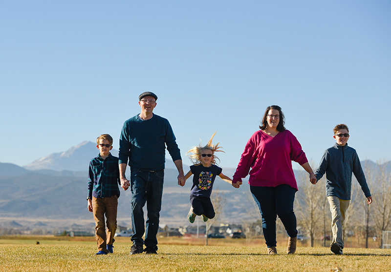 Thanks to DBS for Parkinson's, Mike Whitt can enjoy time with his family. Here, he poses with his wife, two sons and their daughter.