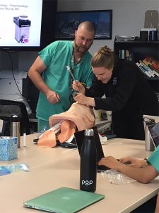 Katie Havranek, shown here practicing intubation, is one of many CU med students who has volunteered to to help support hospital providers caring for COVID-19 patients.