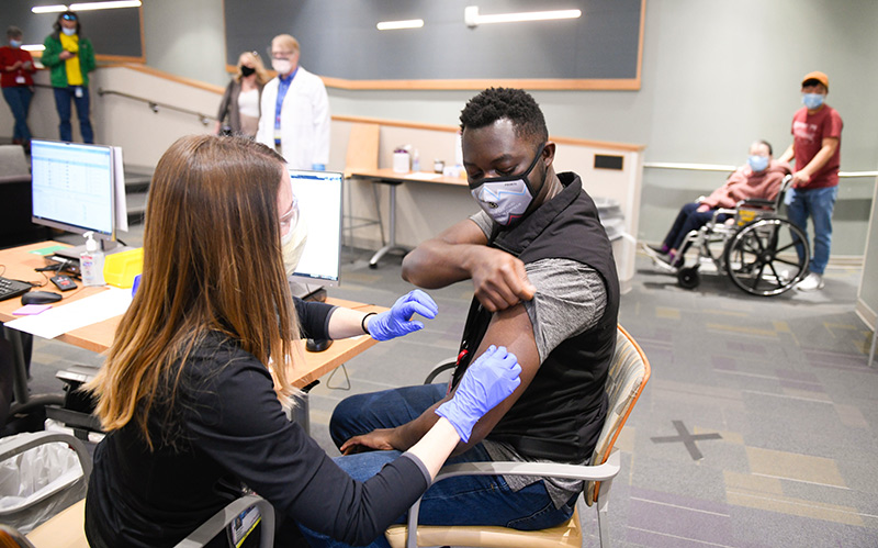 Promoting vaccines among Black people. Dr. Kweku Hazel received his COVID-19 vaccine in late December.