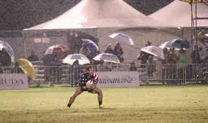 Jonathan Gray plays in the rain, supported by the left knee that Dr. Jason Dragoo repaired with surgery stem cells transplanted from Gray’s stomach. Photo courtesy of Jonathan Gray.