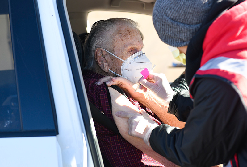 Harold "Tommy" Thompson receives his first dose of the COVID-19 vaccine at a mass vaccination event at Coors Field over the weekend.