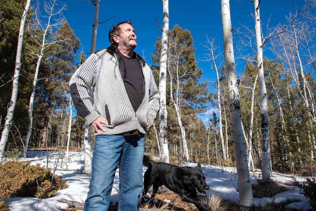 CharlieCHambers looks to the blue sky and aspen trees as he tells his COVID-19 story.