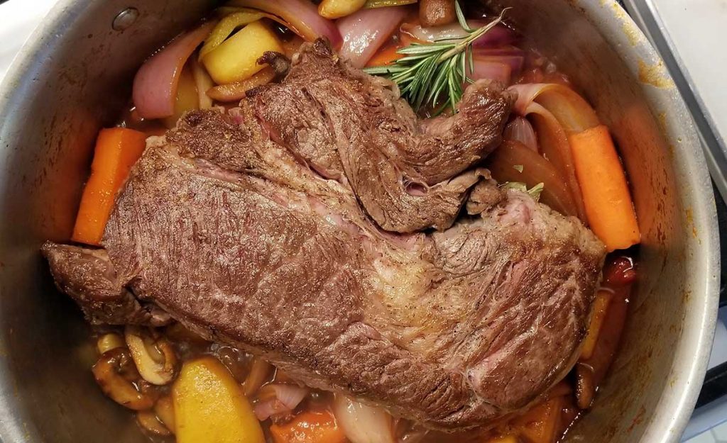The stracotto (Italian) pot roast atop the stove before going to the oven.