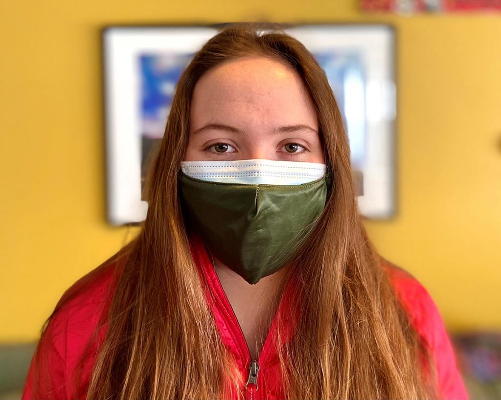young woman wearing a double mask