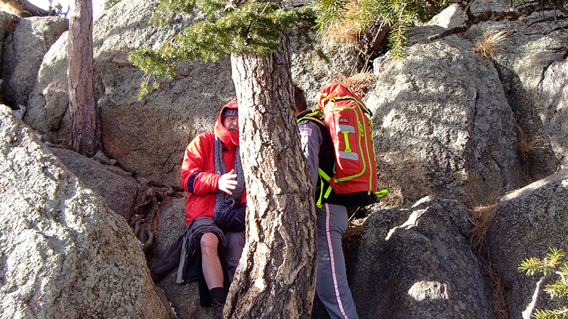 LifeLine crew member, right, helps Phil Sheridan atop of Greyrock mountain during a medical rescue on Jan. 7, 2021.