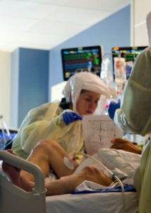 Ventilated patients can’t vocalize; Logan and Freeman improvise a “keyboard” by writing the alphabet on the back of a laminated sheet and having the patient point and spell out words.