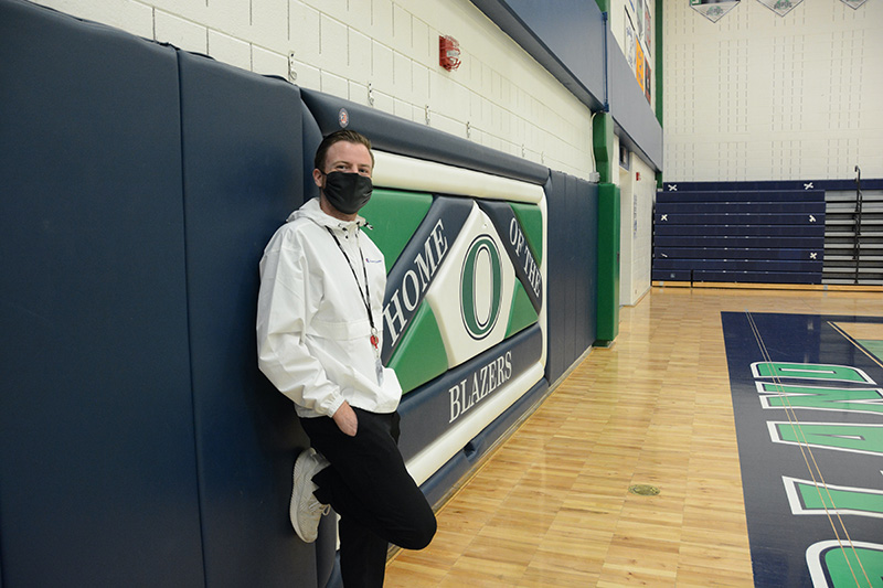 UCHealth athletic trainer, Kyle Thorson, poses in one of the gyms at Overland High School.