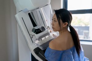 A woman prepares to get a mammogram