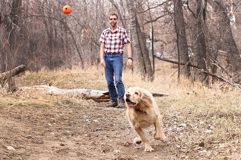 Wade L. Clements enjoys a day with his dog Diesel. Because his employer partners with UCHealth for occupational health services, Wade's heart murmur was found before something serious happened to him.