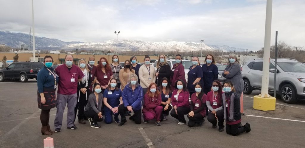 A team of caregivers who provide vaccines at UCHealth Memorial Administrative Center are photographed in parking lot outside the vaccine clinic in Colorado Springs..