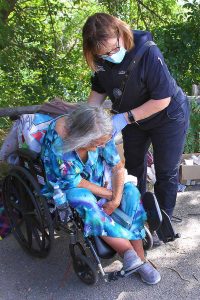 UCHealth Community Paramedics assist a woman who is in distress. Photo: Joel Blocker.